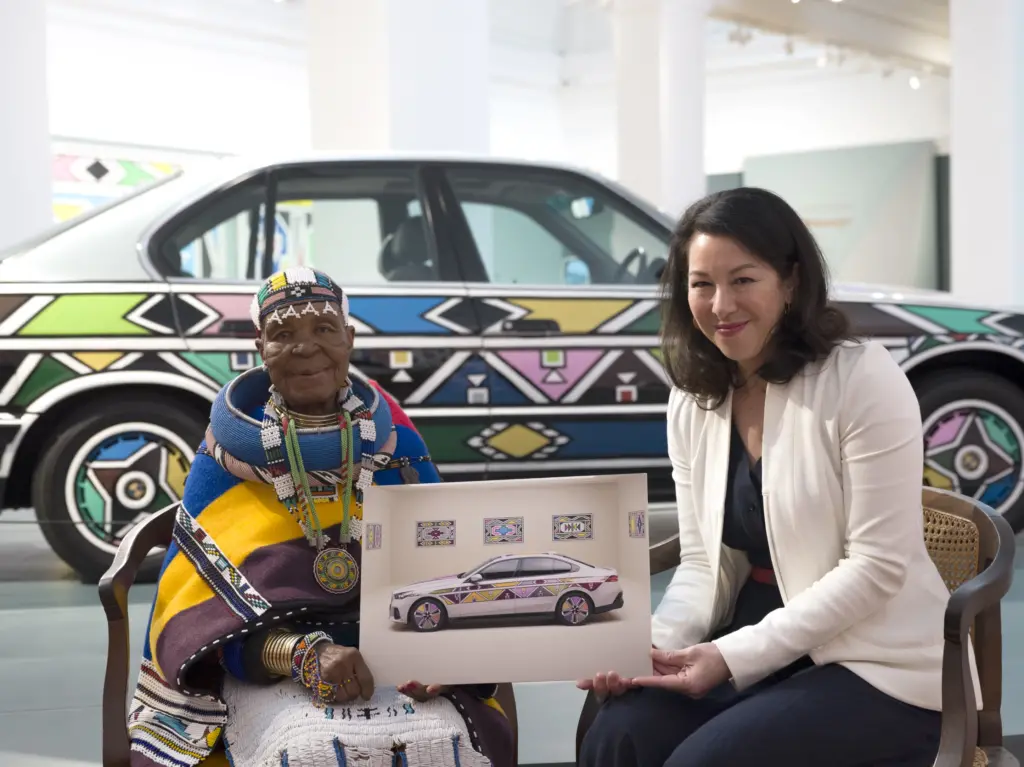 Esther Mahlangu and BMW Group engineer Stella Clarke meet at the opening of Esther Mahlangu's first retrospective in Cape Town. Photo: Clint Strydom